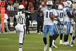 HOUSTON - NOVEMBER 23:  Quarterback Vince Young #10 of the Tennessee Titans high fives with referee Jerome Boger at the end of the game with the Houston Texans on November 23, 2009  at Reliant Stadium in Houston, Texas.  (Photo by Stephen Dunn/Getty Images)