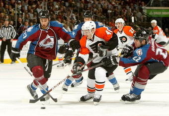 DENVER - NOVEMBER 23:  Danny Briere #48 of the Philadelphia Flyers controls the puck as Kyle Quincey #27 and Scott Hannan #22 of the Colorado Avalanche defend during NHL action at the Pepsi Center on November 23, 2009 in Denver, Colorado.  (Photo by Doug Pensinger/Getty Images)
