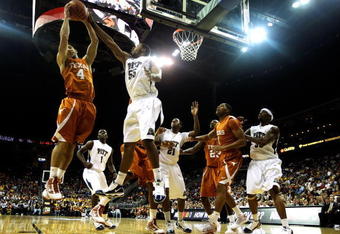 KANSAS CITY, MO - NOVEMBER 24:  Dogus Balbay #4 of the Texas Longhorns battles J.J. Richardson #55 of the Pittsburgh Panthers for a rebound during the CBE Classic championship game on November 24, 2009 at Sprint Center in Kansas City, Missouri.  (Photo by Jamie Squire/Getty Images)