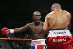 LAS VEGAS - SEPTEMBER 16: (L-R) Joan Guzman of the Dominican Republic taunts Jorge Rodrigo Barrios of Argentina during their WBO World junior lightweight title fight at the MGM Grand Garden Arena September 16, 2006 in Las Vegas, Nevada. Guzman won the title by split decision against Barrios.  (Photo by Ethan Miller/Getty Images)