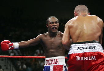 LAS VEGAS - SEPTEMBER 16: (L-R) Joan Guzman of the Dominican Republic taunts Jorge Rodrigo Barrios of Argentina during their WBO World junior lightweight title fight at the MGM Grand Garden Arena September 16, 2006 in Las Vegas, Nevada. Guzman won the title by split decision against Barrios.  (Photo by Ethan Miller/Getty Images)
