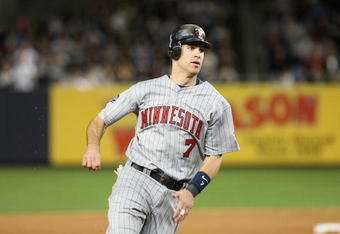 NEW YORK - OCTOBER 07:  Joe Mauer #7 of the Minnesota Twins runs the bases against the New York Yankees in Game One of the ALDS during the 2009 MLB Playoffs at Yankee Stadium on October 7, 2009 in the Bronx borough of New York City.  (Photo by Nick Laham/Getty Images)
