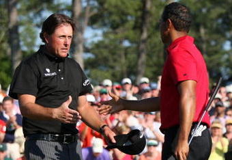 AUGUSTA, GA - APRIL 12:  Phil Mickelson shakes hands with Tiger Woods on the 18th green during the final round of the 2009 Masters Tournament at Augusta National Golf Club on April 12, 2009 in Augusta, Georgia.  (Photo by Andrew Redington/Getty Images)