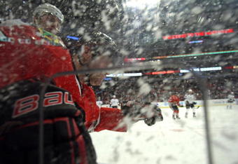 CHICAGO - NOVEMBER 09: John Madden #11 of the Chicago Blackhawks is checked into the boards by Jack Johnson #3 of the Los Angeles Kings at the United Center on November 9, 2009 in Chicago, Illinois. (Photo by Jonathan Daniel/Getty Images)