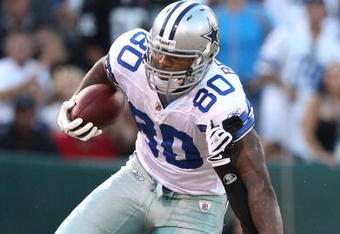 OAKLAND, CA - AUGUST 13: Martellus Bennett #80 of the Dallas Cowboys runs with the ball after catching  a pass over Chris Johnson #37 of the Oakland Raiders during a preseason game at Oakland-Alameda County Coliseum on August 13, 2009 in Oakland, California.  (Photo by Jed Jacobsohn/Getty Images)