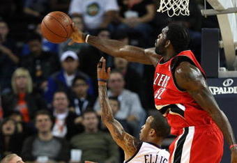 OAKLAND, CA - NOVEMBER 20:  Greg Oden #52 of the Portland Trail Blazers blocks a shot by Monta Ellis #8 of the Golden State Warriors during an NBA game at Oracle Arena on November 20, 2009 in Oakland, California.  (Photo by Jed Jacobsohn/Getty Images)