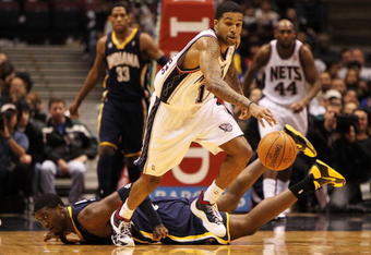 EAST RUTHERFORD, NJ - NOVEMBER 17:  Chris Douglas Roberts #17 of the New Jersey Nets dribbles the ball as Roy Hibbert #55 of The Indiana Pacers lies on the floor during their game on November 17, 2009 at The Izod Center in East Rutherford, New Jersey.  NOTE TO USER: User expressly acknowledges and agrees that, by downloading and/or using this Photograph, user is consenting to the terms and conditions of the Getty Images License Agreement.  (Photo by Al Bello/Getty Images)