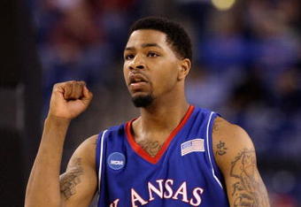 INDIANAPOLIS - MARCH 27:  Marcus Morris #22 of the Kansas Jayhawks reacts to a play against the Michigan State Spartans during the third round of the NCAA Division I Men's Basketball Tournament at the Lucas Oil Stadium on March 27, 2009 in Indianapolis, Indiana.  (Photo by Andy Lyons/Getty Images)