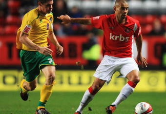 LONDON, ENGLAND - NOVEMBER 24:  Scott Wagstaff of Charlton Athletic holds back Stuart Campbell of Bristol Rovers during the Coca Cola League One Match between Charlton Athletic and Bristol Rovers at the Valley on November 24, 2009 in London, England.  (Photo by Bryn Lennon/Getty Images)