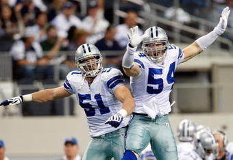ARLINGTON, TX - NOVEMBER 01: Linebacker Bobby Carpenter #54 of the Dallas Cowboys celebrates a quarterback sack with Keith Brooking #51 at Cowboys Stadium on November 1, 2009 in Arlington, Texas.  (Photo by Ronald Martinez/Getty Images)