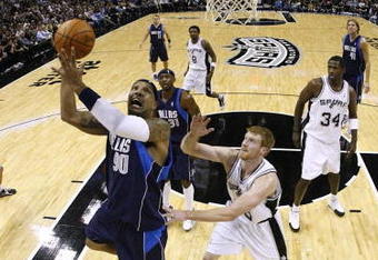 SAN ANTONIO - NOVEMBER 11:  Drew Gooden #90 of the Dallas Mavericks goes up for a shot against Matt Bonner #15 of the San Antonio Spurs during the game at AT&T Center on November 11, 2009 in San Antonio, Texas.  NOTE TO USER: User expressly acknowledges and agrees that, by downloading and or using this photograph, User is consenting to the terms and conditions of the Getty Images License Agreement. (Photo by Ronald Martinez/Getty Images)