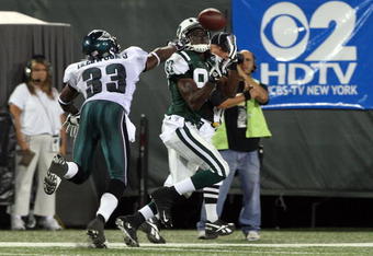 EAST RUTHERFORD, NJ - SEPTEMBER 03:  David Clowney #87 of the New York Jets makes a catch for a touchdown against Jack Ikegwuonu #33 of the Philadelphia Eagles on September 3, 2009 at Giants Stadium in East Rutherford, New Jersey. The Jets defeated the Eagles 38-27.  (Photo by Jim McIsaac/Getty Images)