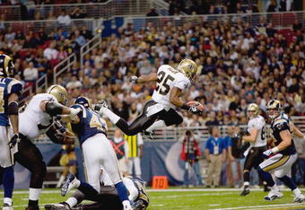 ST. LOUIS - NOVEMBER 15:  Reggie Bush #25 of the New Orleans Saints leaps for the endzone during the game against the St. Louis Rams at the Edward Jones Dome on November 15, 2009 in St. Louis, Missouri.  (Photo by Dilip Vishwanat/Getty Images)