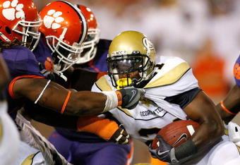 ATLANTA - SEPTEMBER 10:  Da'Quan Bowers #93 and Brandon Thompson #98 of the Clemson Tigers tackle Jonathan Dwyer #21 of the Georgia Tech Yellow Jackets at Bobby Dodd Stadium on September 10, 2009 in Atlanta, Georgia.  (Photo by Kevin C. Cox/Getty Images)