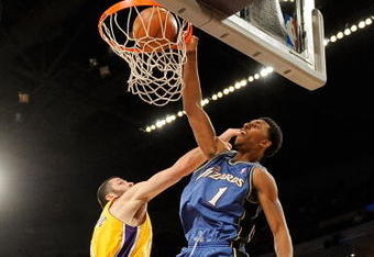 LOS ANGELES, CA - JANUARY 22:  Nick Young #1 of the Washington Wizards dunks against Vladimir Radmanovic #10 of the Los Angeles Lakers during the fourth quarter at the Staples Center January 22, 2009 in Los Angeles, California. NOTE TO USER: User expressly acknowledges and agrees that, by downloading and/or using this Photograph, user is consenting to the terms and conditions of the Getty Images License Agreement.  (Photo by Kevork Djansezian/Getty Images)