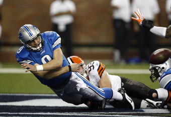 DETROIT, MI - NOVEMBER 22: Matthew Stafford #9 of the Detroit Lions tries to pass the football before being sacked in the end zone against Jason Trusnik #93 the Cleveland Browns at Ford Field on November 22, 2009 in Detroit, Michigan. Stafford was called for intentional grounding resulting in a safety for the Browns. The Lions came from behind to defeat the Browns 38-37. (Photo by Joe Robbins/Getty Images)