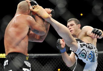 LAS VEGAS - NOVEMBER 21: Tito Ortiz (L) battles Forrest Griffin (R) during their Light Heavyweight Fight at the UFC 106 at Mandalay Bay Events Center on November 21, 2009 in Las Vegas, Nevada. (Photo by Jon Kopaloff/Getty Images)