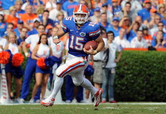 GAINESVILLE, FL - NOVEMBER 21: Quarterback Tim Tebow #15 of the Florida Gators rushes upfield against the Florida International University Golden Panthers, November 21, 2009 at Ben Hill Griffin Stadium in Gainesville, Florida.  (Photo by Al Messerschmidt/Getty Images)