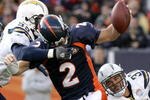 DENVER - NOVEMBER 22:  Quarterback Chris Simms #2 of the Denver Broncos is sacked by Kevin Burnett #99 and Eric Weddle #32 of the San Diego Chargers during NFL action at Invesco Field at Mile High on November 22, 2009 in Denver, Colorado.  (Photo by Doug Pensinger/Getty Images)
