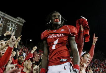 CINCINNATI - NOVEMBER 13:  Mardy Gilyard #1 of the Cincinnati Bearcats celebrates with fans after his teams 24-21 win over the West Virginia Mountaineers in the game at Nippert Stadium on November 13, 2009 in Cincinnati, Ohio.  (Photo by Andy Lyons/Getty Images)