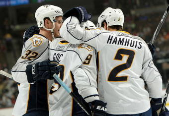 DENVER - NOVEMBER 25:  Marcel Goc #9 of the Nashville Predators is congratulated for his first period goal by Dan Hamhuis #2 and Cody Franson #32 to give Nashville a 2-0 lead over the Colorado Avalanche during NHL action at the Pepsi Center on November 25, 2009 in Denver, Colorado.  (Photo by Doug Pensinger/Getty Images)