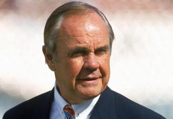 LOS ANGELES - NOVEMBER 14: Commentator Dick Enberg looks on during season game with the Kansas City Chiefs against the Los Angeles Raiders at the Los Angeles Memorial Coliseum on November14, 1993 in Los Angeles, California. The Chiefs won 31-20. (Photo by George Rose/Getty Images)