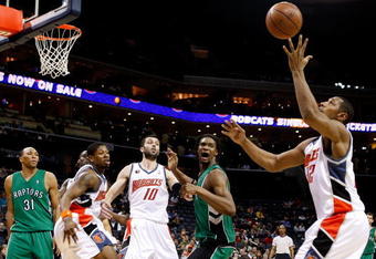 CHARLOTTE, NC - MARCH 16:  Chris Bosh #4 of the Toronto Raptors watches as Boris Diaw #32 of the Charlotte Bobcats grabs a rebound during their game at Time Warner Cable Arena on March 16, 2009 in Charlotte, North Carolina.  NOTE TO USER: User expressly acknowledges and agrees that, by downloading and/or using this Photograph, user is consenting to the terms and conditions of the Getty Images License Agreement.  (Photo by Streeter Lecka/Getty Images)