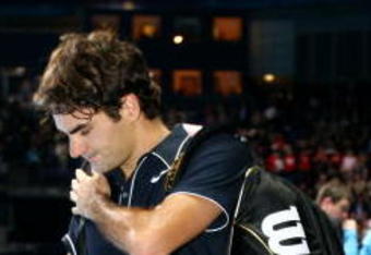 LONDON, ENGLAND - NOVEMBER 26:  Roger Federer of Switzerland leaves after his men's singles round robin match against Juan Martin Del Potro of Argentina during the Barclays ATP World Tour Finals at the O2 Arena on November 26, 2009 in London, England  (Photo by Matthew Lewis/Getty Images for Barclays ATP Finals)