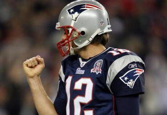 FOXBORO, MA - NOVEMBER 22:  Tom Brady #12 of the New England Patriots celebrates Laurence Maroney's touchdown run in the second quarter against the New York Jets on November 22, 2009 at Gillette Stadium in Foxboro, Massachusetts.  (Photo by Elsa/Getty Images)
