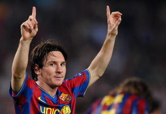 BARCELONA, SPAIN - SEPTEMBER 29:  Lionel Messi of Barcelona celebrates scoring his sides opening goal during the Champions League group F match between Barcelona and Dynamo Kiev at the Camp Nou Stadium on September 29, 2009 in Barcelona, Spain. Barcelona won the match 2-0.  (Photo by Jasper Juinen/Getty Images)