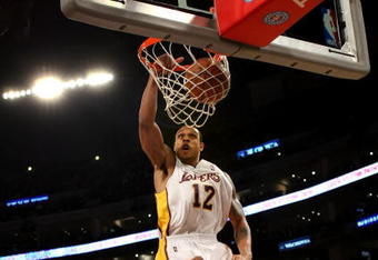 LOS ANGELES - NOVEMBER 15:  Shannon Brown #12 of the Los Angeles Lakers dunks a rebound against the Houston Rockets on November 15, 2009 at Staples Center in Los Angeles, California.   NOTE TO USER: User expressly acknowledges and agrees that, by downloading and/or using this Photograph, user is consenting to the terms and conditions of the Getty Images License Agreement.   (Photo by Stephen Dunn/Getty Images)