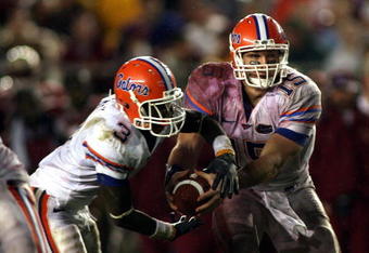 TALLAHASSEE, FL - NOVEMBER 29:  Quarterback Tim Tebow #15 of the Florida Gators hands off to running back Chris Rainey #3 against the Florida State Seminoles with teammate Jeffrey Demps #2 at Bobby Bowden Field at Doak Campbell Stadium on November 29, 2008 in Tallahassee, Florida.  Florida defeated Florida State 45-15.  (Photo by Marc Serota/Getty Images)
