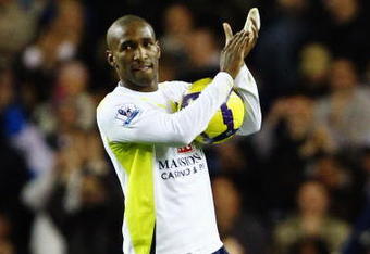 LONDON, ENGLAND - NOVEMBER 22:  Jermain Defoe of Tottenham Hotspur collects the match ball after scoring five during the Barclays Premier League match between Tottenham Hotspur and Wigan Athletic at White Hart Lane on November 22, 2009 in London, England.  (Photo by Clive Rose/Getty Images)