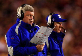LANDOVER, MD - DECEMBER 30:  Quarterbacks coach Kevin Gilbride (L) and head coach Tom Coughlin of the New York Giants look on from the sidelines against the Washington Redskins at FedEx Field on December 30, 2006 in Landover, Maryland.  (Photo by Jamie Squire/Getty Images)