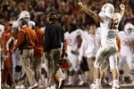 COLLEGE STATION, TX - NOVEMBER 26: Quarterback Colt McCoy #12 of the Texas Longhorns celebrates against the Texas A&M Aggies in the second half at Kyle Field on November 26, 2009 in College Station, Texas. The Longhorns defeated the Aggies 49-39.(Photo by Aaron M. Sprecher/Getty Images)
