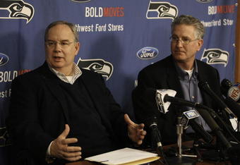 KIRKLAND, WA - FEBRUARY 06:  Team president Tim Ruskell (L) and CEO Tod Leiweke of the Seattle Seahawks address the media during a press conference announcing that Seahawks' assistant coach Jim Mora will take over as head coach in the 2009 season, on February 6, 2008 at Seahawks Headquarters in Kirkland, Washington. Holmgren will coach the team in 2008.  (Photo by Otto Greule Jr/Getty Images)