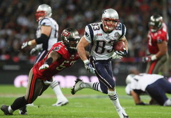 LONDON, ENGLAND - OCTOBER 25:  Adam Hayward (#57) of Tampa Bay Buccaneers tries to tackle Wes Welker (#83) of the New England Patriots during the NFL International Series match between New England Patriots and Tampa Bay Buccaneers at Wembley Stadium on October 25, 2009 in London, England. This is the third occasion where a regular season NFL match has been played in London.  (Photo by Elsa/Getty Images)