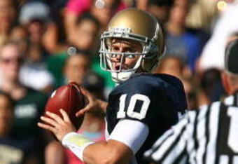 SOUTH BEND, IN - SEPTEMBER 19: Dayne Crist #10 of the Notre Dame Fighting Irish looks for a receiver against the Michigan State Spartans on September 19, 2009 at Notre Dame Stadium in South Bend, Indiana. Notre Dame defeated Michigan State 33-30. (Photo by Jonathan Daniel/Getty Images)