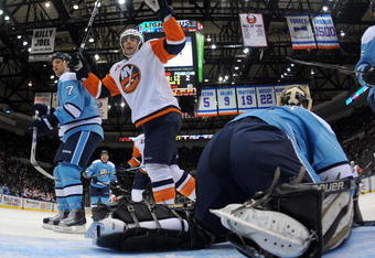UNIONDALE, NY - NOVEMBER 27: John Tavares #91 (not shown) of the New York Islanders scores the game winning goal at 13:48 of the third period as Matt Moulson #26 (R) celebrates in front against the Pittsburgh Penguins at the Nassau Coliseum on November 27, 2009 in Uniondale, New York.  The Islanders defeated the Penguins 3-2. (Photo by Bruce Bennett/Getty Images)