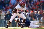 AUBURN, AL - NOVEMBER 27:  Julio Jones #8 of the Alabama Crimson Tide tries to break a tackle by Barrett Trotter #14 of the Auburn Tigers at Jordan-Hare Stadium on November 27, 2009 in Auburn, Alabama.  (Photo by Kevin C. Cox/Getty Images)