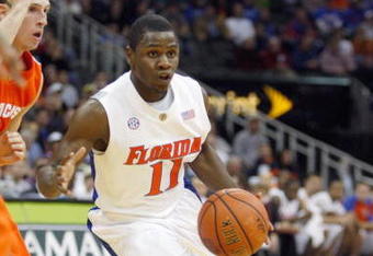 KANSAS CITY, MO - NOVEMBER 24: Erving Walker #11 of the Florida Gators drives the ball downcourt against the Syracuse Orange during the CBE Classic game on November 24, 2008 at the Sprint Center in Kansas City, Missouri. (Photo by Jamie Squire/Getty Images)