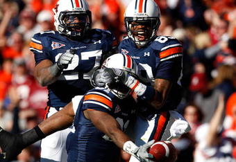 AUBURN, AL - NOVEMBER 27:  Terrell Zachery #81 (L) of the Auburn Tigers celebrates his touchdown against the Alabama Crimson Tide with Mario Fannin #27 and Darvin Adams #89 at Jordan-Hare Stadium on November 27, 2009 in Auburn, Alabama.  (Photo by Kevin C. Cox/Getty Images)