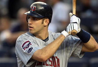 NEW YORK - OCTOBER 09:  Joe Mauer #7 of the Minnesota Twins bats against the New York Yankees in Game Two of the ALDS during the 2009 MLB Playoffs at Yankee Stadium on October 9, 2009 in the Bronx borough of New York City.  (Photo by Jim McIsaac/Getty Images)