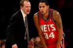 LOS ANGELES, CA - NOVEMBER 25:  Head coach Lawrence Frank and Devin Harris #34 of the New Jersey Nets confer during the game with the Los Angeles Lakers on November 25, 2008 at Staples Center in Los Angeles, California. The Lakers won 120-93.   NOTE TO USER: User expressly acknowledges and agrees that, by downloading and/or using this Photograph, user is consenting to the terms and conditions of the Getty Images License Agreement.  (Photo by Stephen Dunn/Getty Images)