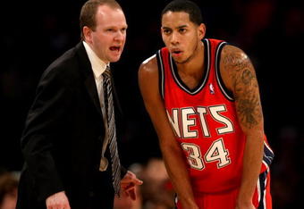 LOS ANGELES, CA - NOVEMBER 25:  Head coach Lawrence Frank and Devin Harris #34 of the New Jersey Nets confer during the game with the Los Angeles Lakers on November 25, 2008 at Staples Center in Los Angeles, California. The Lakers won 120-93.   NOTE TO USER: User expressly acknowledges and agrees that, by downloading and/or using this Photograph, user is consenting to the terms and conditions of the Getty Images License Agreement.  (Photo by Stephen Dunn/Getty Images)