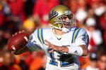 LOS ANGELES, CA - DECEMBER 01:  Quarterback Patrick Cowan #12 of the UCLA Bruins looks to pass during the college football game against the USC Trojans at the Los Angeles Memorial Coliseum on December 1, 2007 in Los Angeles, California. The Trojans defeated the Bruins 24-7. (Photo by Donald Miralle/Getty Images)