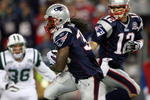 FOXBORO, MA - NOVEMBER 22:  Tom Brady #12 of the New England Patriots hands the ball off to Laurence Maroney #39 in the third quarter against against the New York Jets on November 22, 2009 at Gillette Stadium in Foxboro, Massachusetts. The Patriots defeated the Jets 31-14.  (Photo by Elsa/Getty Images)
