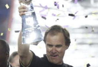 28 Jan 2001: Head coach Brian Billick of the Baltimore Ravens is presented the Lombardi Trophy after defeating the New York Giants during Super Bowl XXXV at Raymond James Stadium in Tampa, Florida. The Ravens defeated the Giants 34-7. DIGITAL IMAGE. Mandatory Credit: Brian Bahr/ALLSPORT