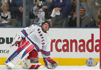 TORONTO - DECEMBER 16:  Henrik Lundqvist #30 of the New York Rangers tries to collect himself after losing his helmet while giving up the 5th goal of the game scored by the Toronto Maple Leafs during their NHL game at the Air Canada Centre on December 16, 2006 in Toronto, Ontario, Canada.  (Photo By Dave Sandford/Getty Images)