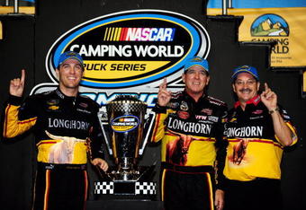 HOMESTEAD, FL - NOVEMBER 20:  (L-R) Team owner Kevin Harvick, driver Ron Hornaday Jr., driver of the #33 VFW.org Chevrolet, and crew chief Rick Ren, celebrate winning the series title in Victory Lane after finishing 8th in the NASCAR Camping World Truck Series Ford 200 at Homestead-Miami Speedway on November 20, 2009 in Homestead, Florida.  (Photo by Rusty Jarrett/Getty Images for NASCAR)